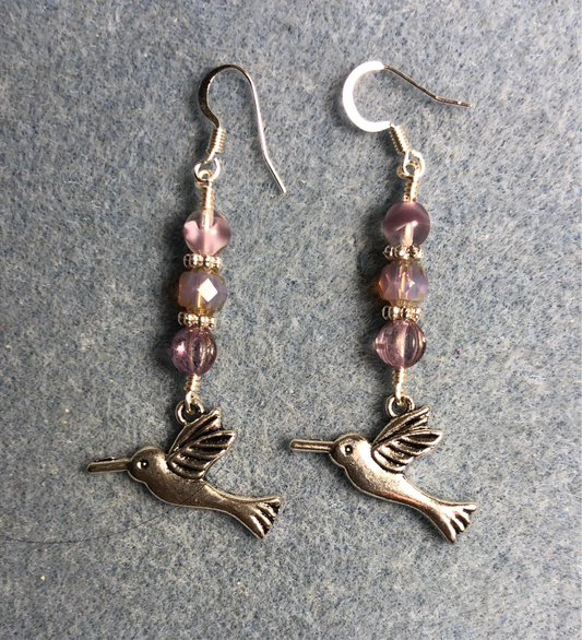 Silver hummingbird charm earrings adorned with violet Czech glass beads