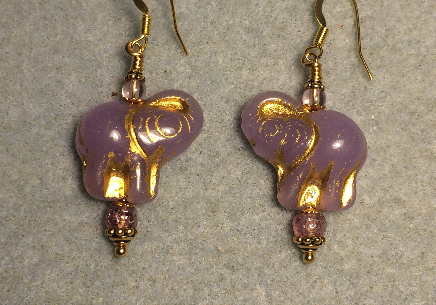 Opaque violet (with gold inlay) Czech glass elephant bead earrings adorned with violet Czech glass beads.