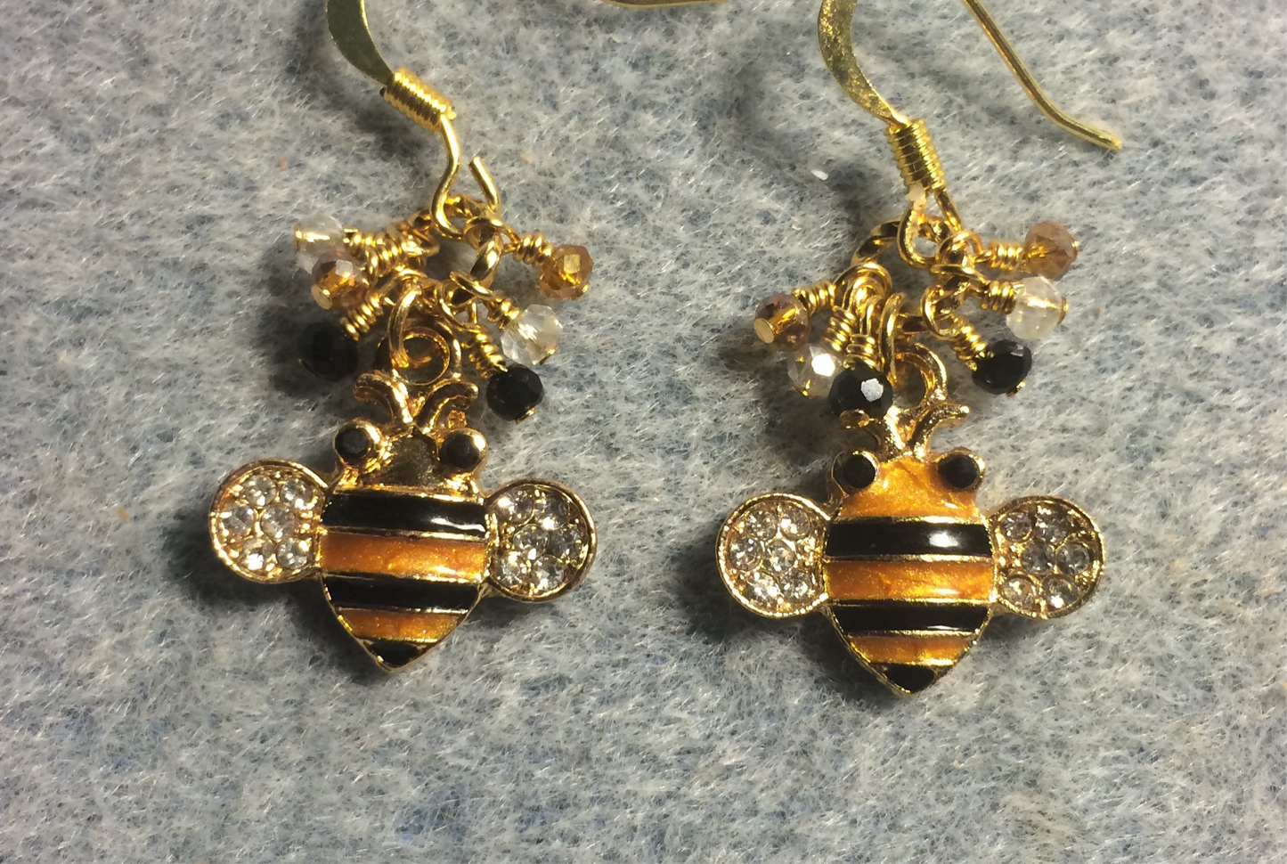 Topaz and black enamel and rhinestone striped honeybee charm earrings adorned with tiny dangling topaz, clear, and black Chinese crystal beads.