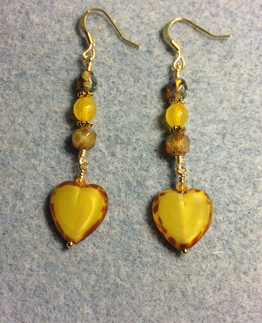 Golden yellow Czech glass heart bead earrings adorned with golden yellow Czech glass beads.