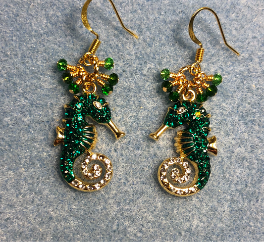 Emerald green and gold rhinestone seahorse charm earrings adorned with tiny dangling emerald green Chinese crystal beads.