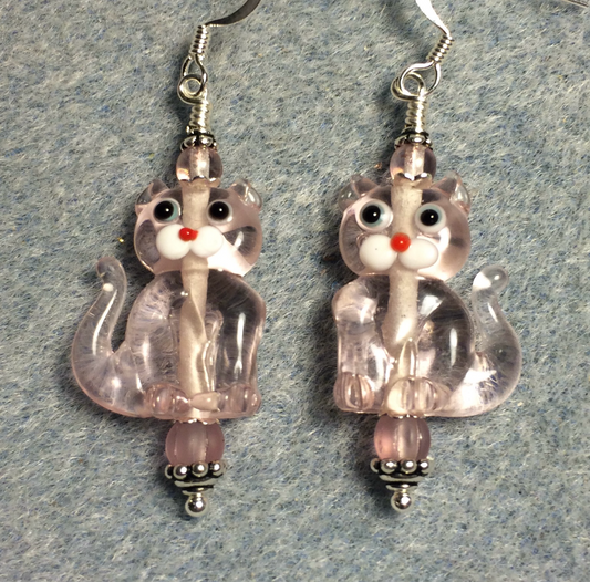 Translucent light pink lamp work cat bead earrings adorned with pink Czech glass beads.