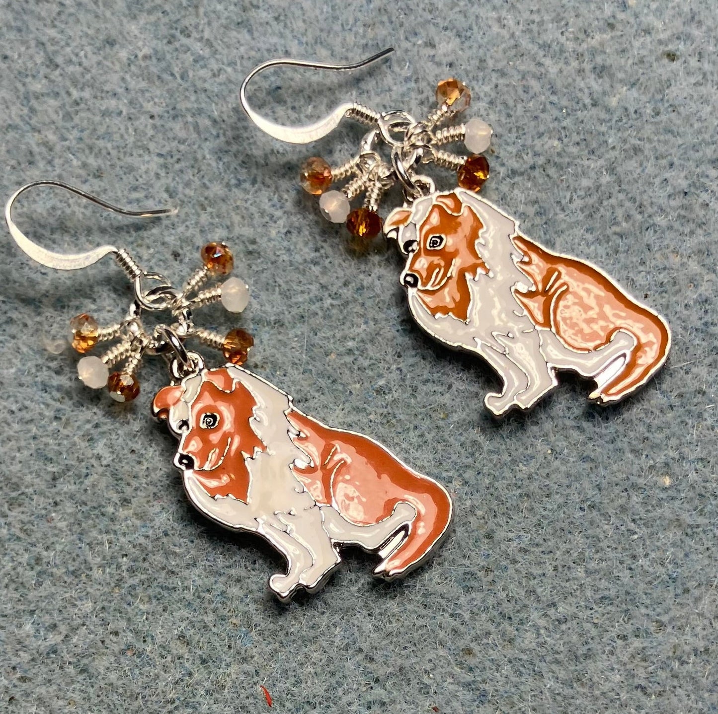 White and brown enamel collie charm earrings adorned with tiny dangling white and brown Chinese crystal beads.