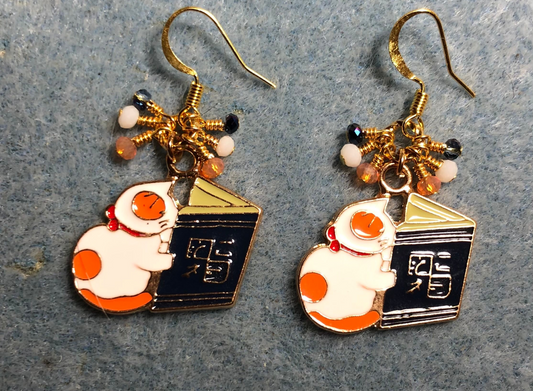 White, orange, and blue enamel cat charm earrings adorned with tiny dangling white, orange, and blue Chinese crystal beads.