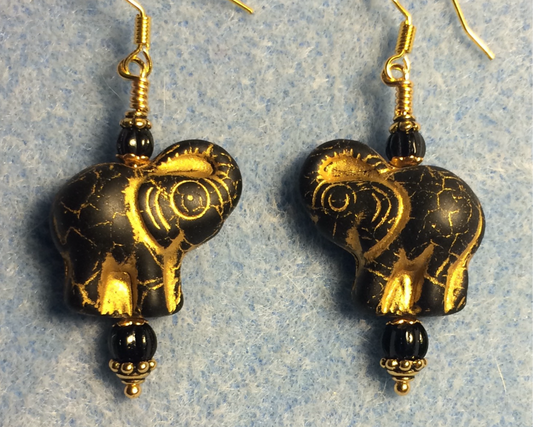 Black matte (with gold inlay) Czech glass elephant bead earrings adorned with black Czech glass beads.