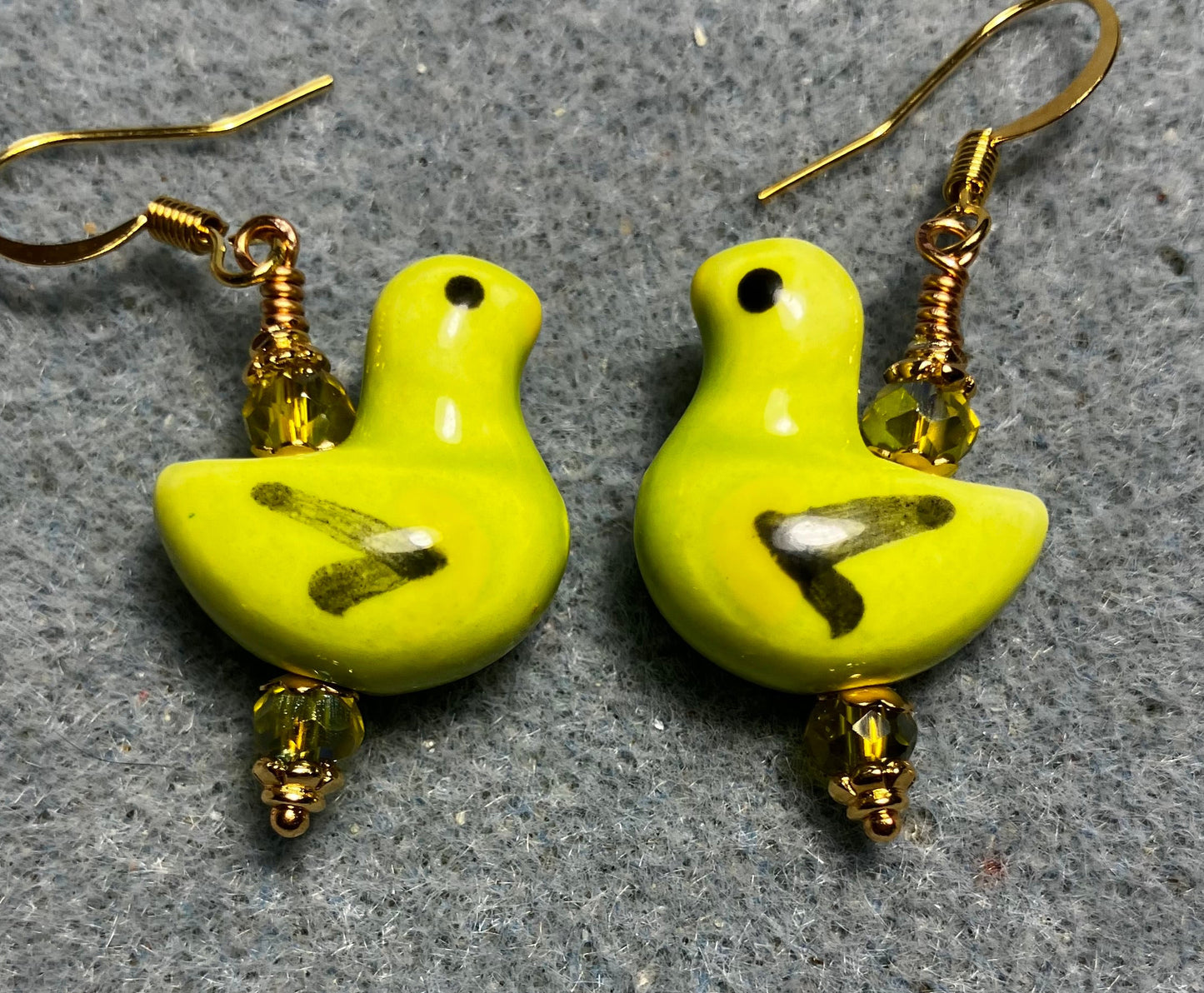 Lime green, black, and yellow ceramic duck bead earrings adorned with lime green Chinese crystal beads.