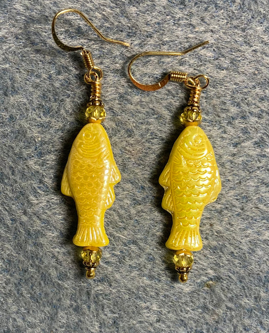 Shimmery yellow Czech glass fish bead earrings adorned with yellow Chinese crystal beads.