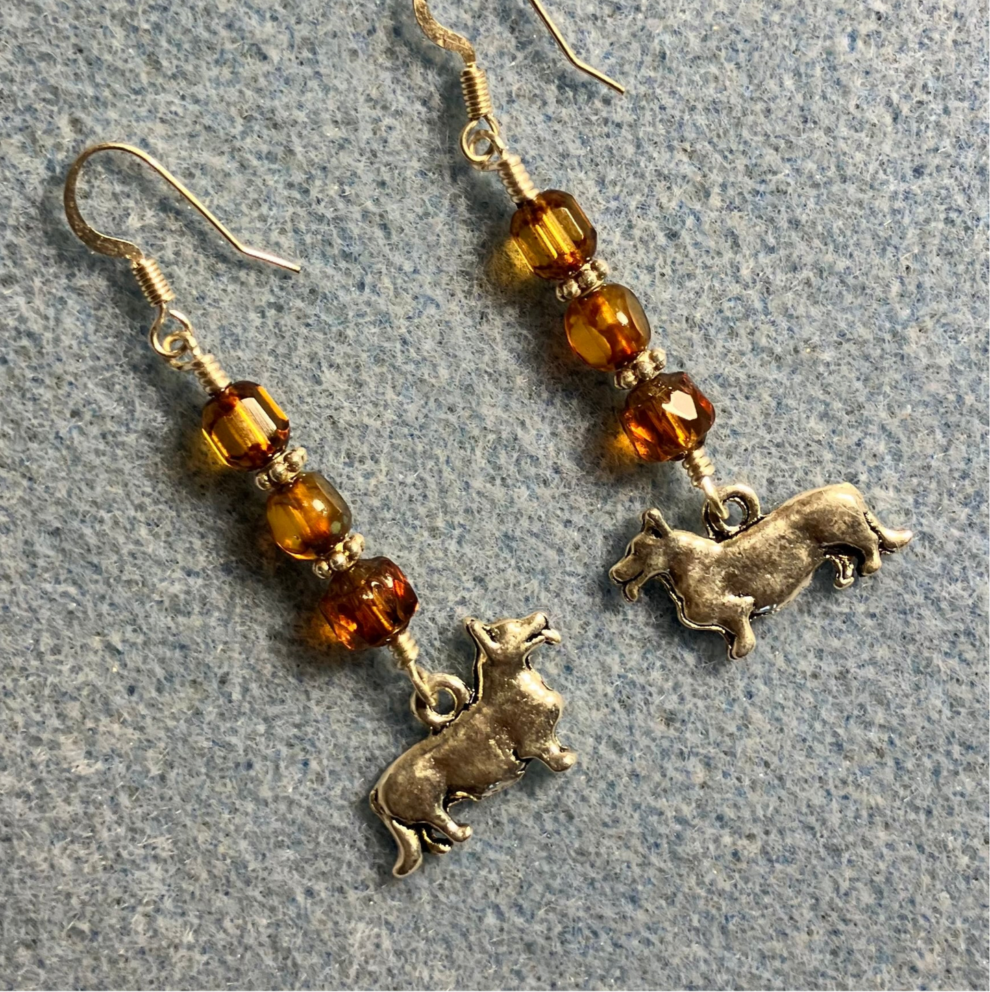 Silver corgi charm earrings adorned with amber Czech glass beads