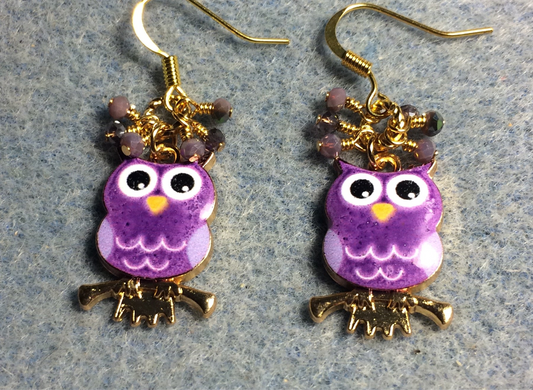 Purple, lavender, and white enamel owl charm earrings adorned with tiny dangling purple and lavender Chinese crystal beads.