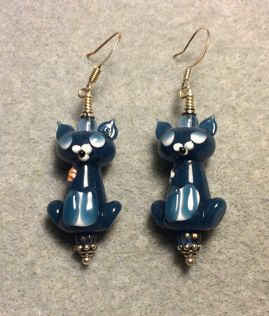 Opaque blue lamp cat bead earrings adorned with blue Czech glass beads.