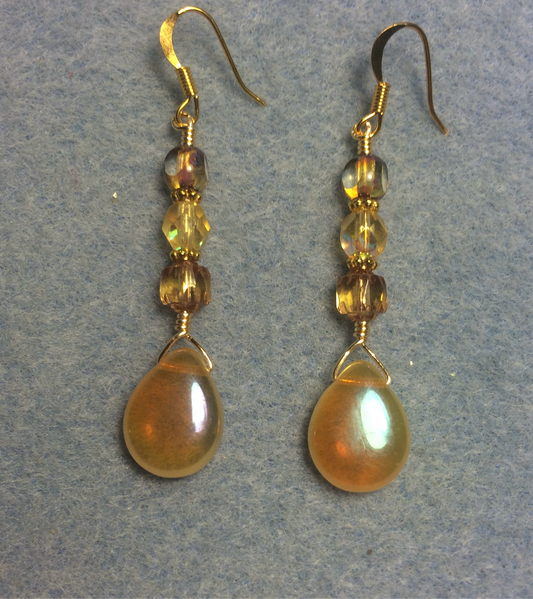 Amber Czech glass pear drop bead earrings adorned with amber Czech glass beads.