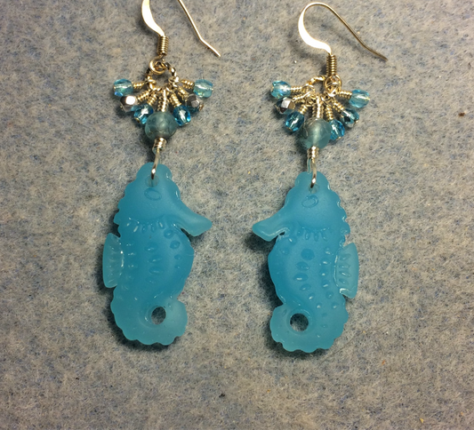 Opaque light aqua sea glass seahorse pendant bead earrings adorned with light aqua Czech glass beads and small dangling light aqua Czech glass beads.