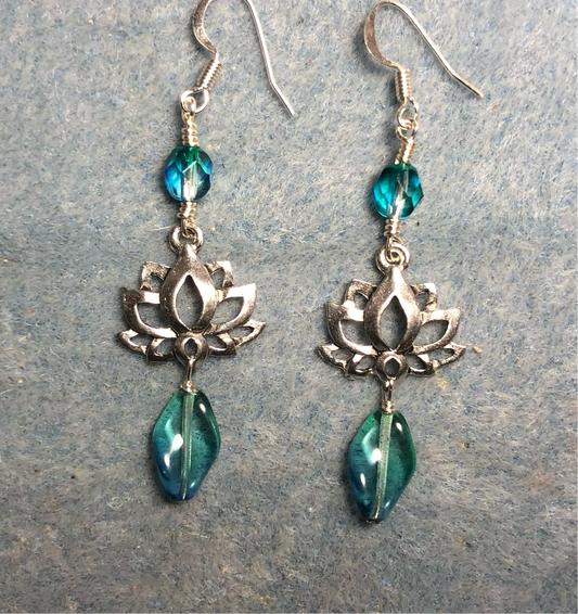 Silver lotus flower connector charm earrings adorned with blue green Czech glass drop beads and blue green Czech glass beads.