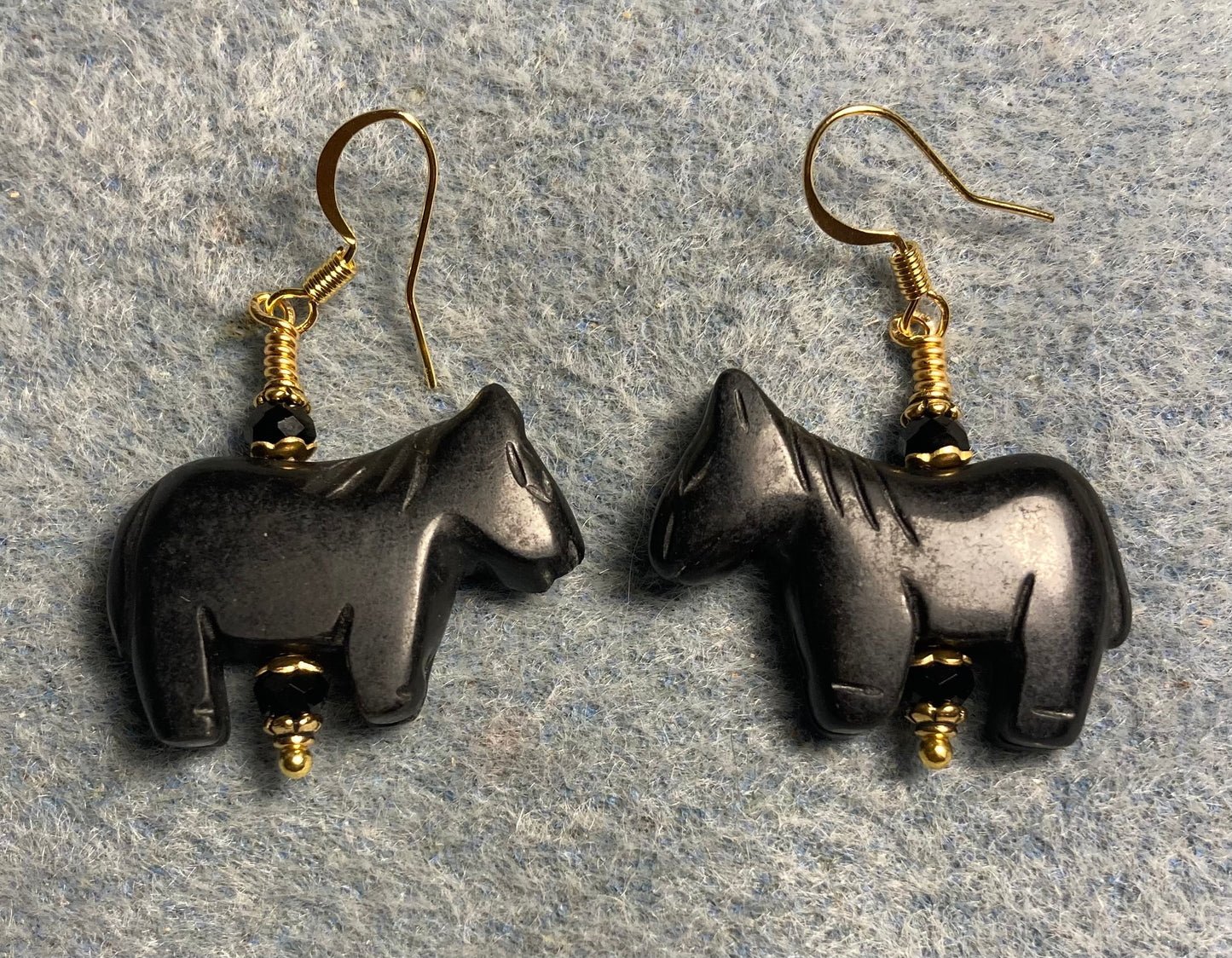 Black onyx gemstone horse bead earrings adorned with black Chinese crystal beads.