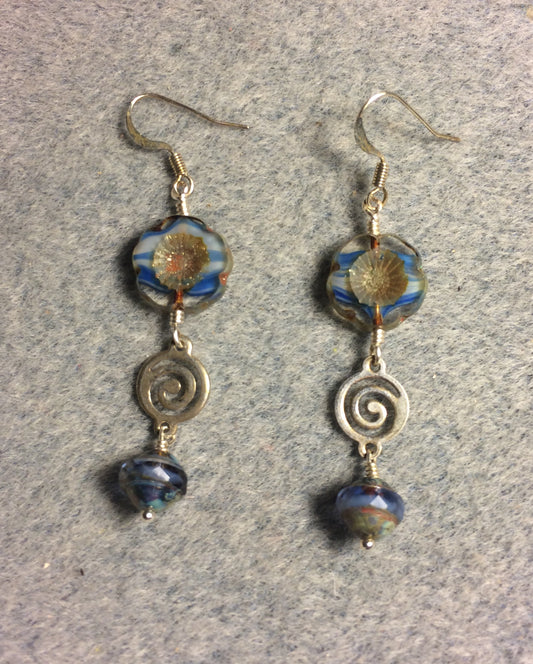 Blue striped Czech glass pansy bead earrings adorned with silver swirly connectors and blue Czech glass Saturn beads.