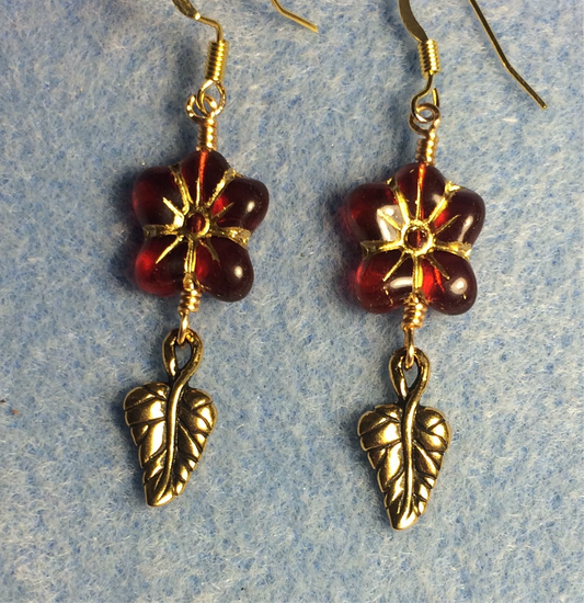 Dark red (with gold inlay) Czech glass puffy flower bead earrings adorned with gold Tierracast leaf charms.