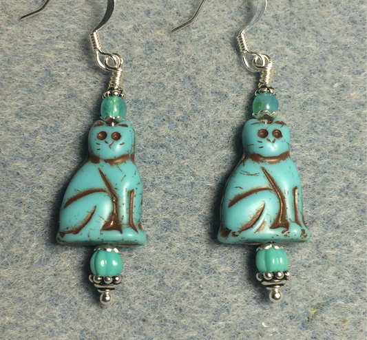 Opaque turquoise (with brown inlay) Czech glass cat bead earrings adorned with turquoise Czech glass beads.