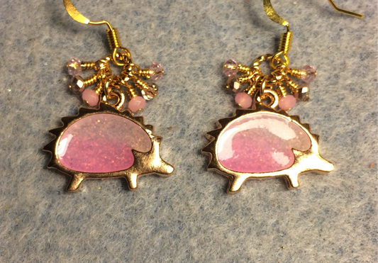 Gold and sparkly pink resin hedgehog charm earrings adorned with tiny dangling pink and gold Chinese crystal beads.