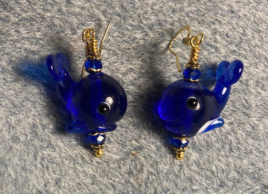 Dark blue lamp work whale bead earrings adorned with dark blue Chinese crystal beads.