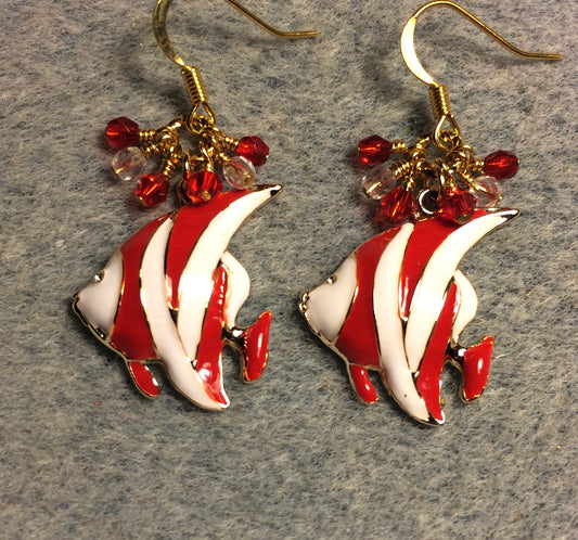 Red and white enamel striped angelfish charm earrings adorned with small dangling red and clear Czech glass beads.