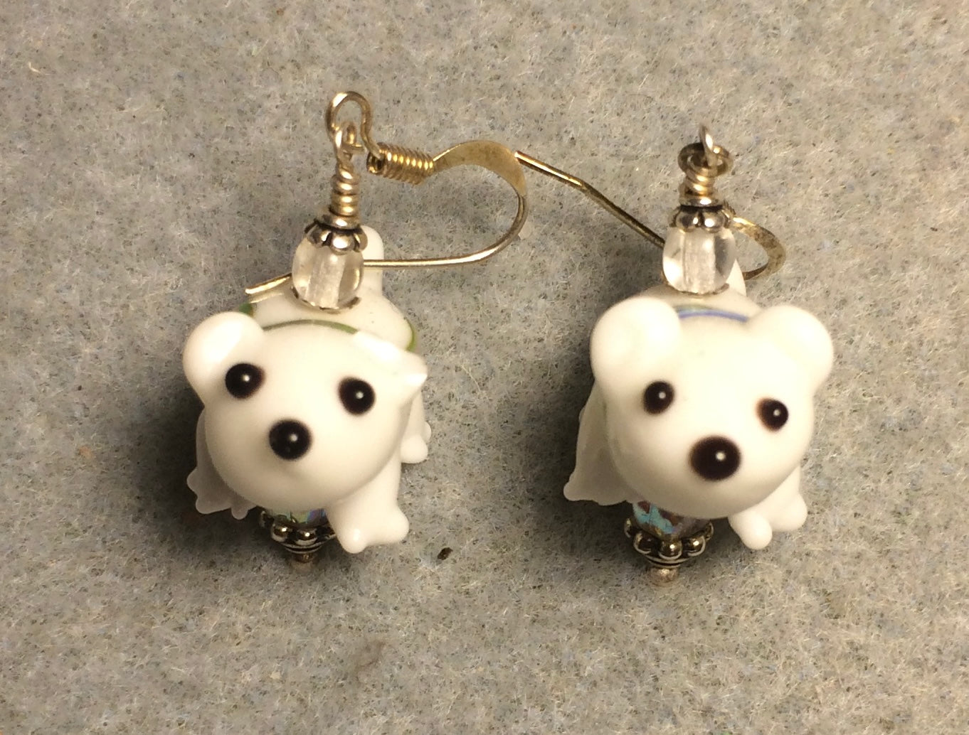 White lamp work polar bear bead earrings adorned with clear Czech glass beads.
