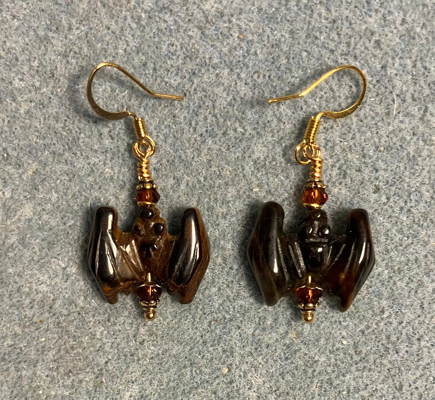 Brown tigereye gemstone bat bead earrings adorned with brown Chinese crystal beads.