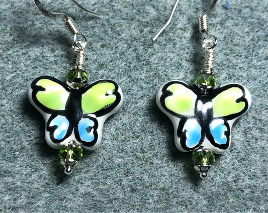 Olive green and light blue ceramic butterfly bead earrings adorned with olive green Chinese crystal beads.