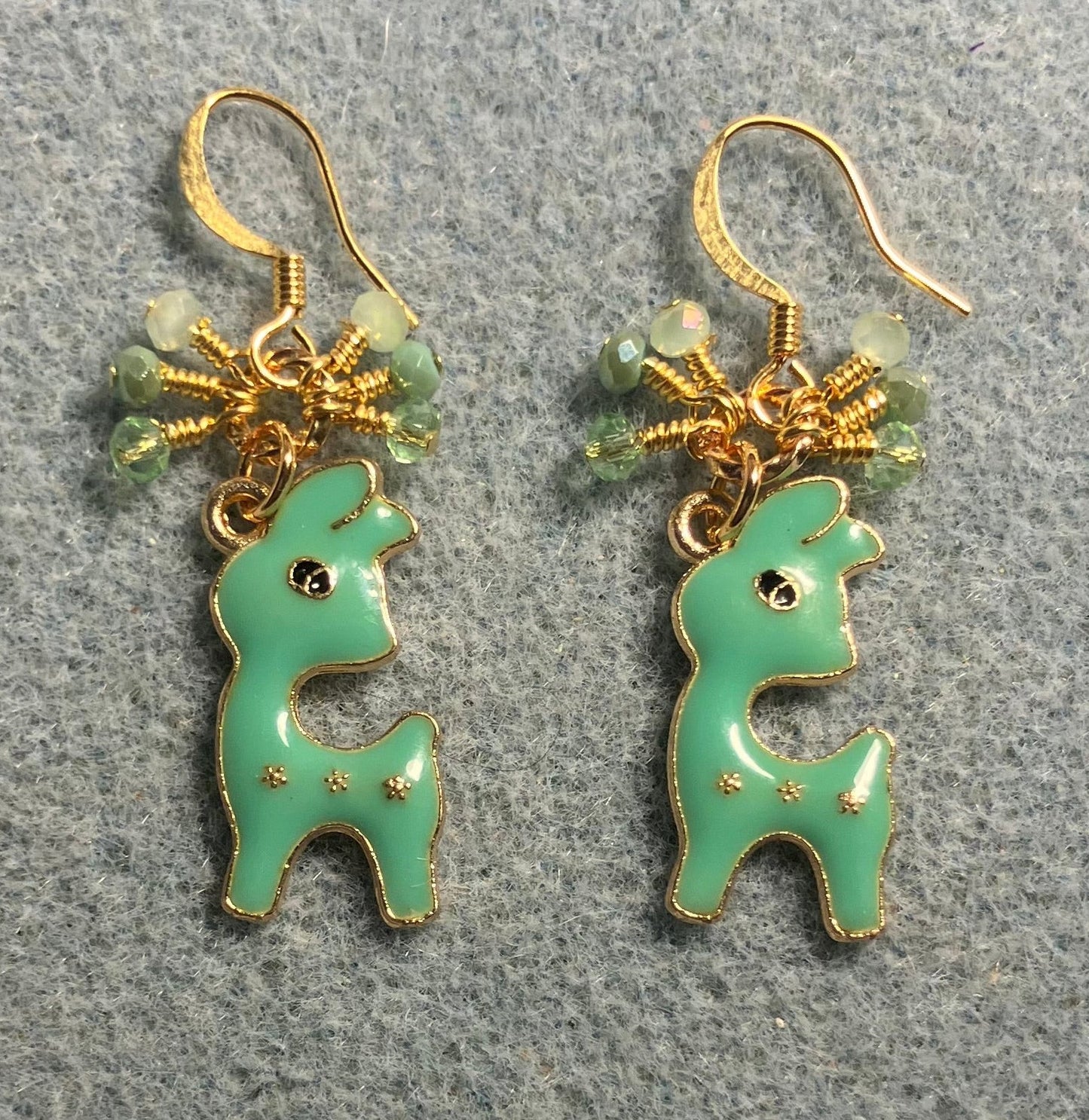 Green enamel deer charm earrings adorned with tiny dangling green Chinese crystal beads.