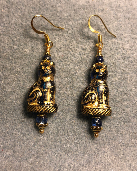 Dark blue (with gold inlay) Czech glass cat bead earrings adorned with dark blue Chinese crystal beads.