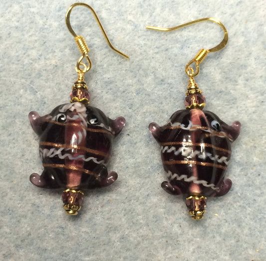 Violet lamp work frog bead earrings adorned with violet Chinese crystal beads.
