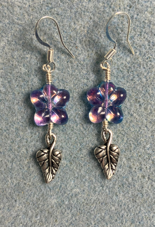 Sparkly purple Czech glass puffy flower bead earrings adorned with silver Tierracast leaf charms.