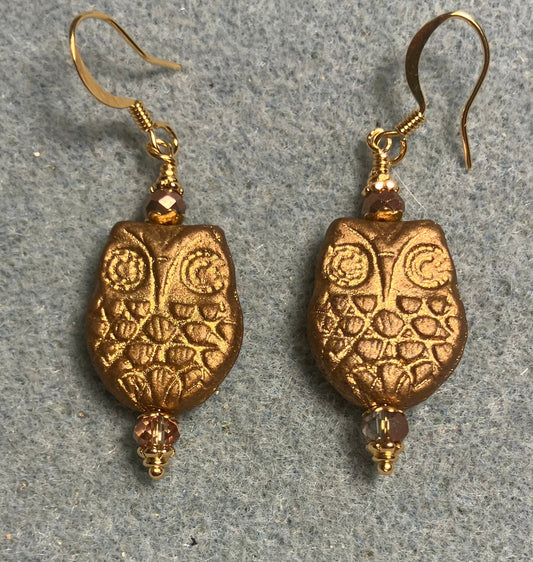 Gold Czech glass owl bead earrings adorned with gold Chinese crystal beads.