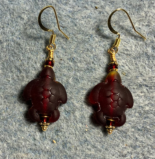 Dark red sea glass sea turtle bead earrings adorned with dark red Chinese crystal beads.