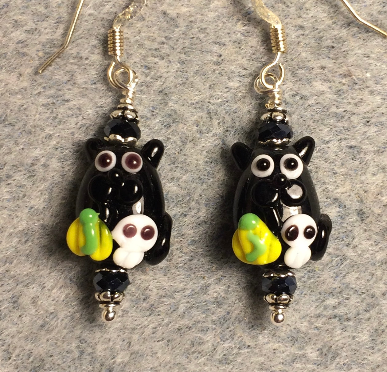 Small black lamp work cat bead earrings adorned with black Chinese crystal beads.