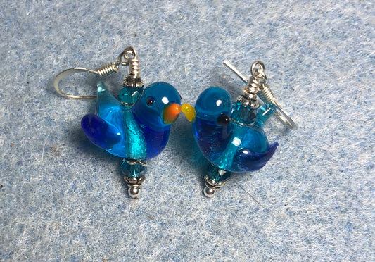 Translucent turquoise blue lamp work songbird bead earrings adorned with turquoise Chinese crystal beads.