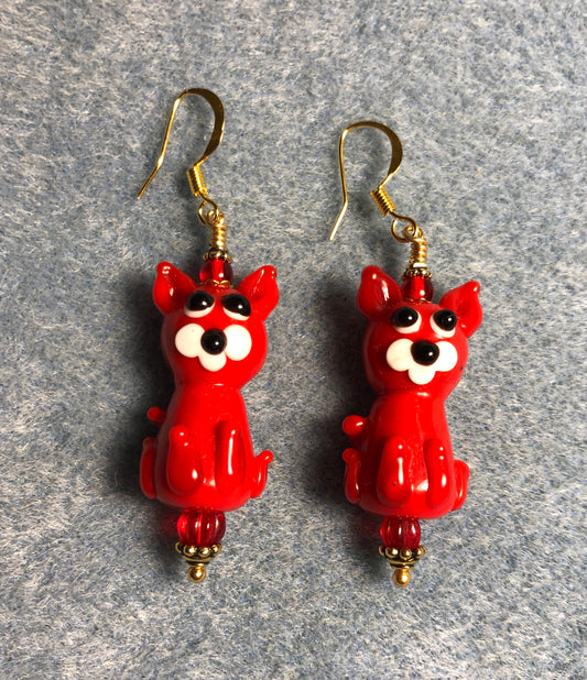 Opaque red lamp work cat bead earrings adorned with red Czech glass beads.