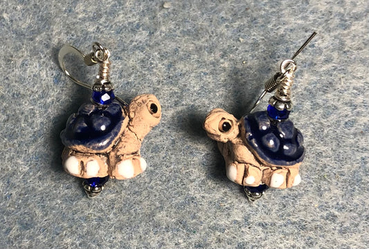 Small dark blue and tan ceramic turtle bead earrings adorned with dark blue Chinese crystal beads.