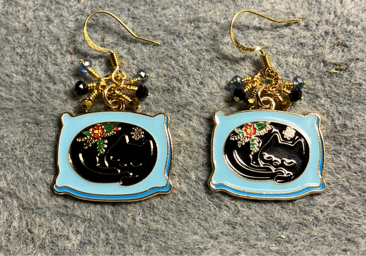 Black and blue enamel cat charm earrings adorned with tiny dangling black, blue, and gold Chinese crystal beads.