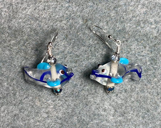Light blue, turquoise, and clear lamp work fish bead earrings adorned with sparkly blue Chinese crystal beads.