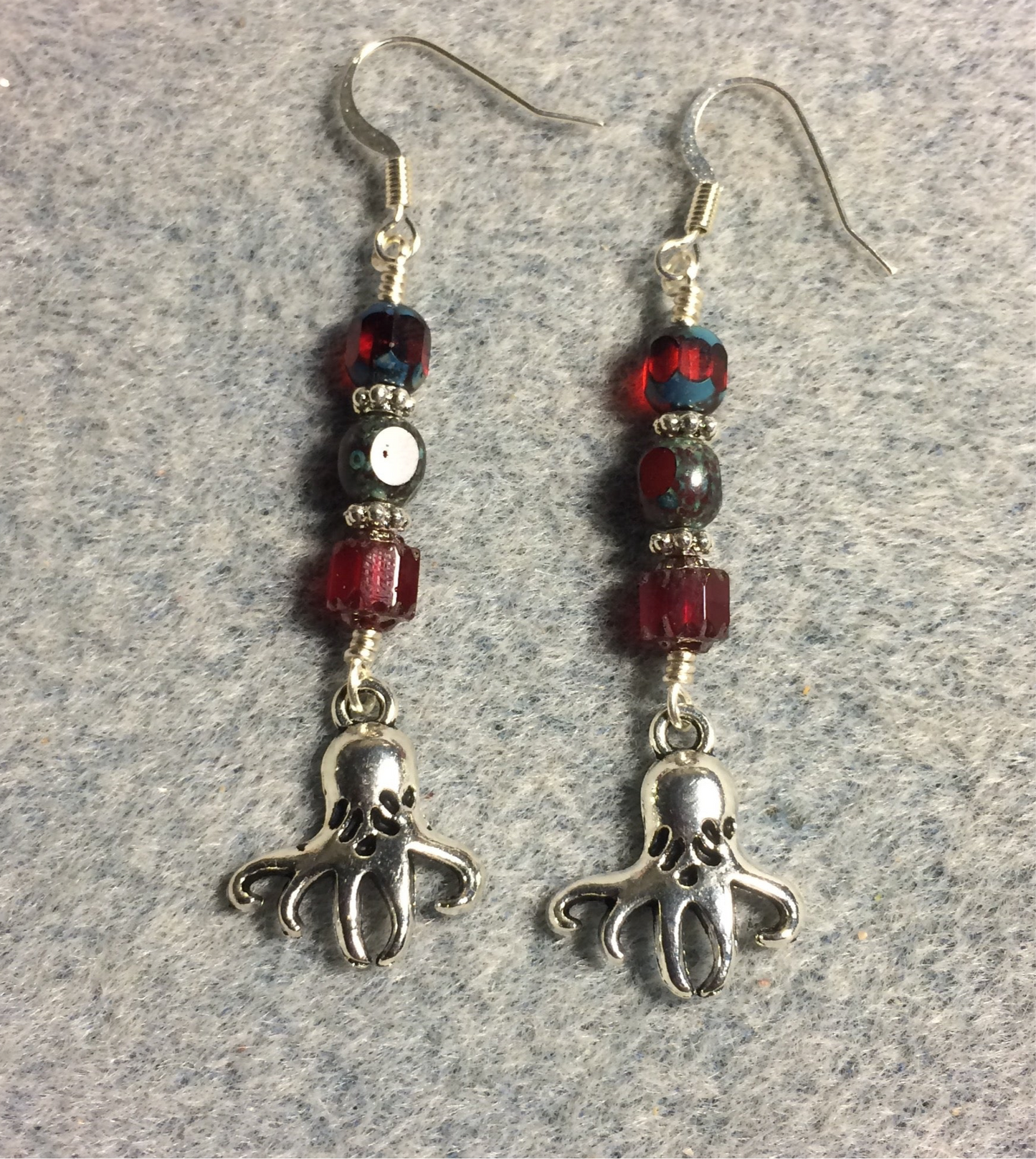 Silver octopus charm earrings adorned with dark red Czech glass beads