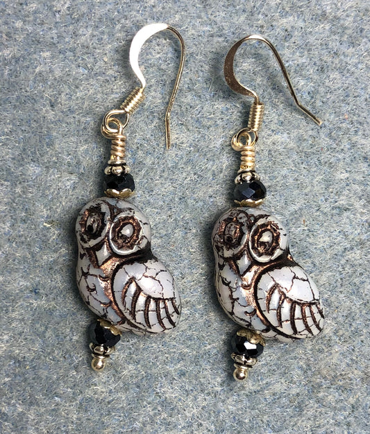 Light blue (with black wash) fancy Czech glass owl bead earrings adorned with black Chinese crystal beads.