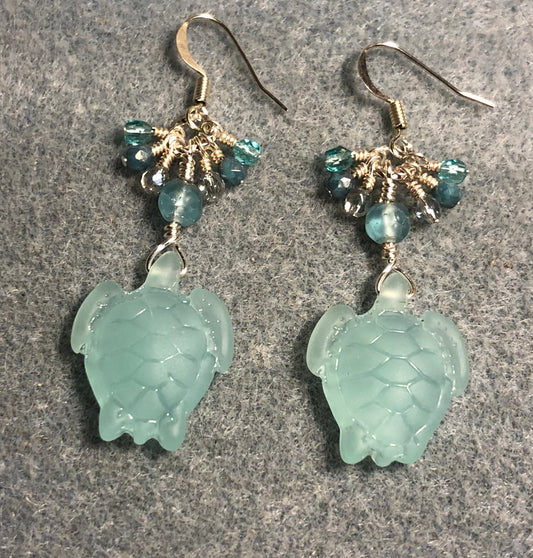 Opaque light green sea glass sea turtle bead earrings adorned with light green Czech glass beads and small dangling light green Czech glass beads.