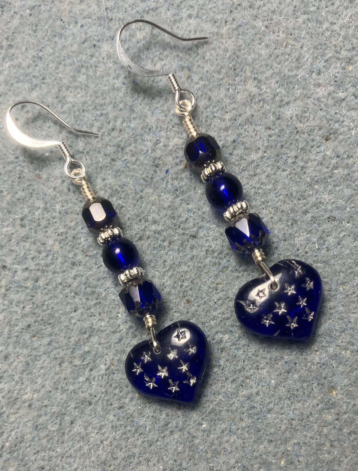 Dark blue Czech glass heart bead earrings adorned with dark blue Czech glass beads.