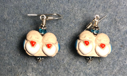 Small tan, red, and turquoise ceramic pair of lovebird bead earrings adorned with turquoise Chinese crystal beads.