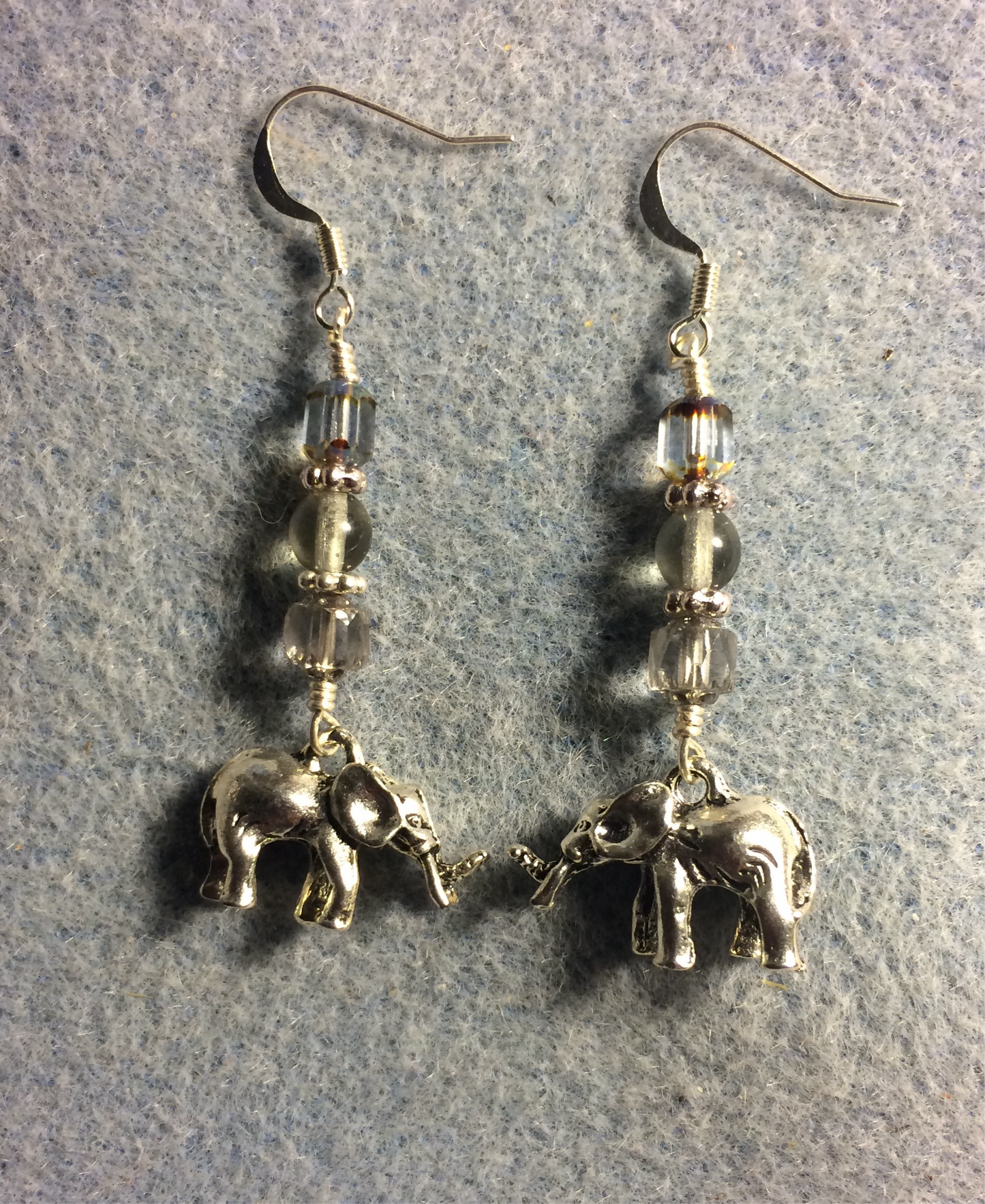 Silver elephant charm earrings adorned with gray Czech glass beads