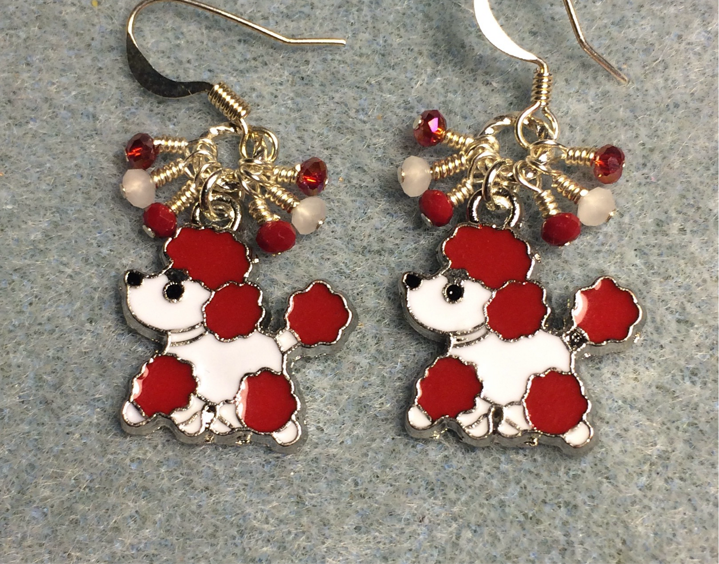 Red and white enamel poodle charm earrings adorned with tiny dangling red and white Chinese crystal beads.