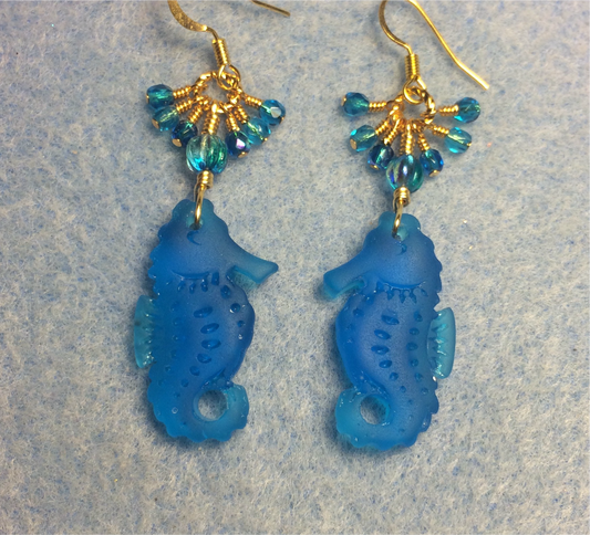 Turquoise sea glass seahorse pendant bead earrings adorned with turquoise Czech glass beads and small dangling turquoise Czech glass beads.