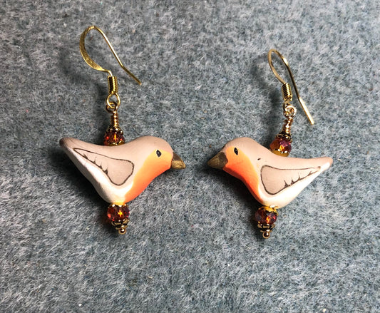 Tan and orange polymer clay bird bead earrings adorned with orange Chinese crystal beads.