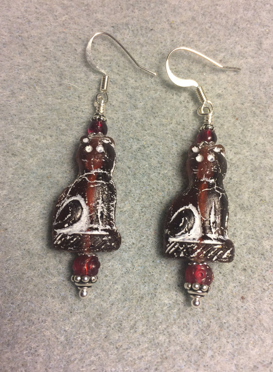 Dark red (with white inlay) fancy Czech glass cat bead earrings adorned with dark red Czech glass beads.