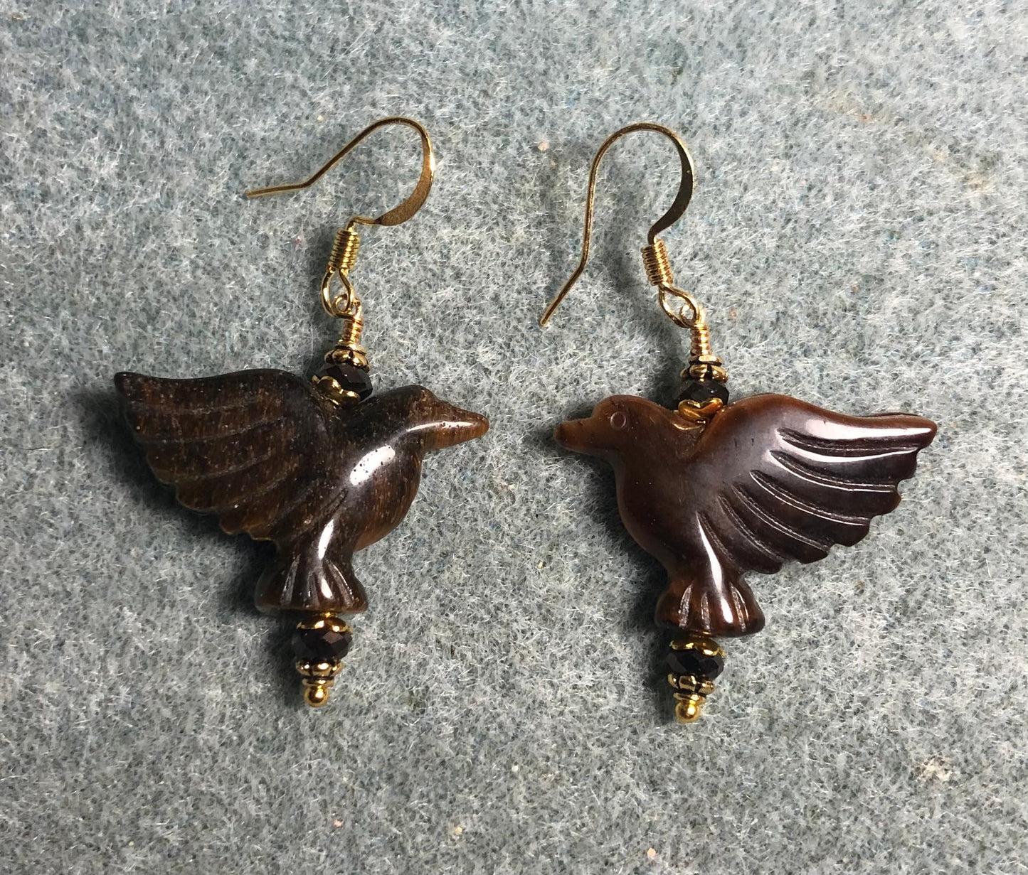 Brown tigereye gemstone flying eagle earrings adorned with brown Chinese crystal beads.